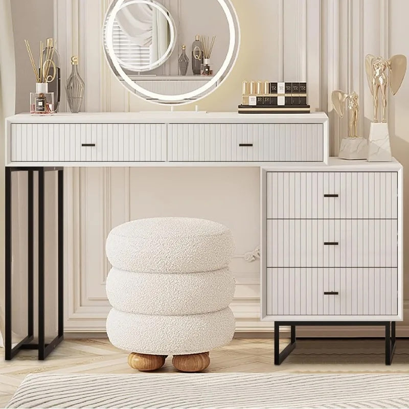 Makeup vanity in use with cosmetics displayed